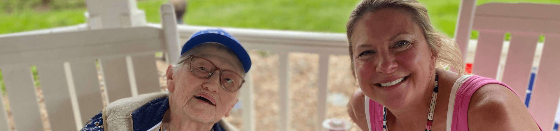 Younger And Older Woman Smile At Camera